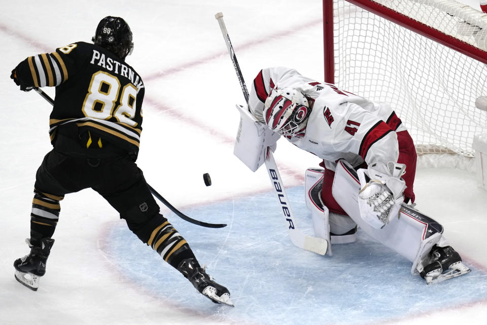 Carolina Hurricanes goaltender Spencer Martin (41) makes a save on a shot by Boston Bruins right wing David Pastrnak (88) during the first period of an NHL hockey game Wednesday, Jan. 24, 2024, in Boston. (AP Photo/Charles Krupa)
