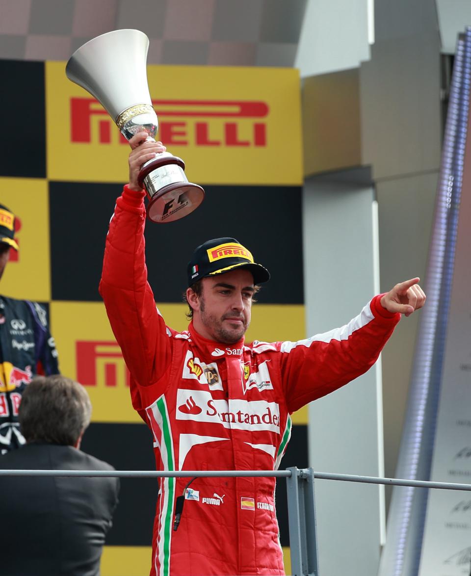 Ferrari's Fernando Alonso celebrates on the podium after the Italian Grand Prix and the Autodromo Nazionale Monza, Monza, Italy.