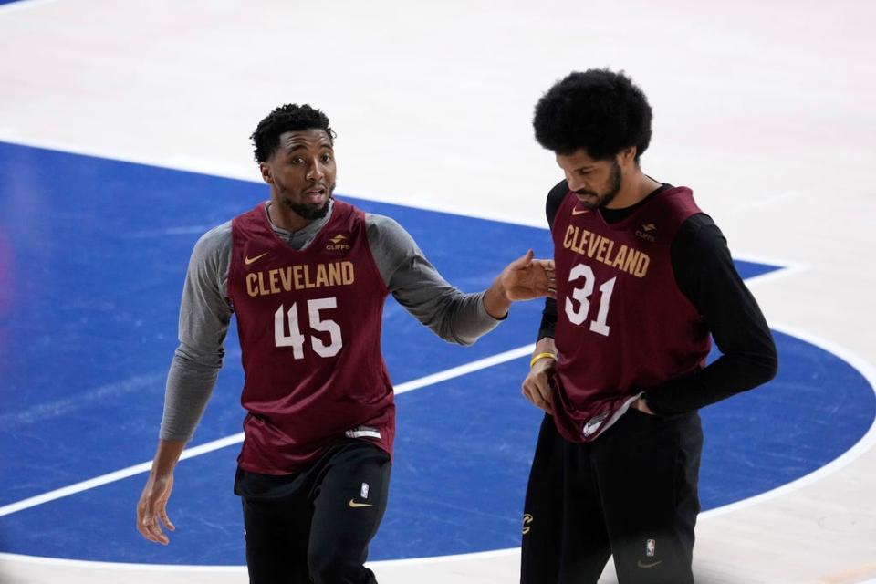 Cavaliers guard Donovan Mitchell, left, and center Jarrett Allen talk during a training session on the eve playing the Brooklyn Nets, in Levallois-Perret, outside Paris, Wednesday, Jan. 10, 2024.