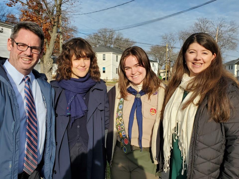 Portsmouth Public Library director Steve Butzel, library staff member Laura Horwood-Benton, Eagle Scout candidate Loreley Godfrey, and state Sen. Rebecca Perkins Kwoka celebrate Godfrey's Little Free Libraries project at Gosling Meadows in Portsmouth Sunday, Nov. 21, 2021.