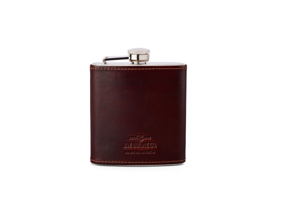 Nothing transports alcohol more fashionably than a leather-covered flask, and this one has been carefully distressed for an antiqued look that looks just right being snuck out of your selvedge Levis.