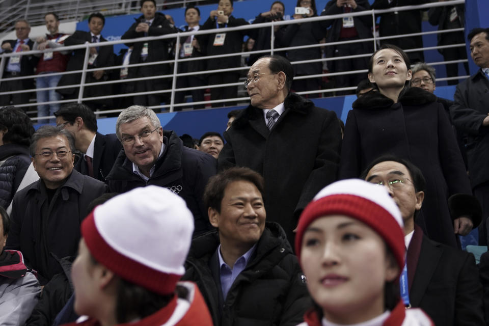 Kim Yo Jong, sister of North Korean leader Kim Jong Un, standing right, and North Korea’s nominal head of state Kim Yong Nam, second right, join Thomas Bach, President of the International Olympic Committee, at a women’s hockey game between Switzerland and the combined Koreas at the 2018 Winter Olympics. (AP)