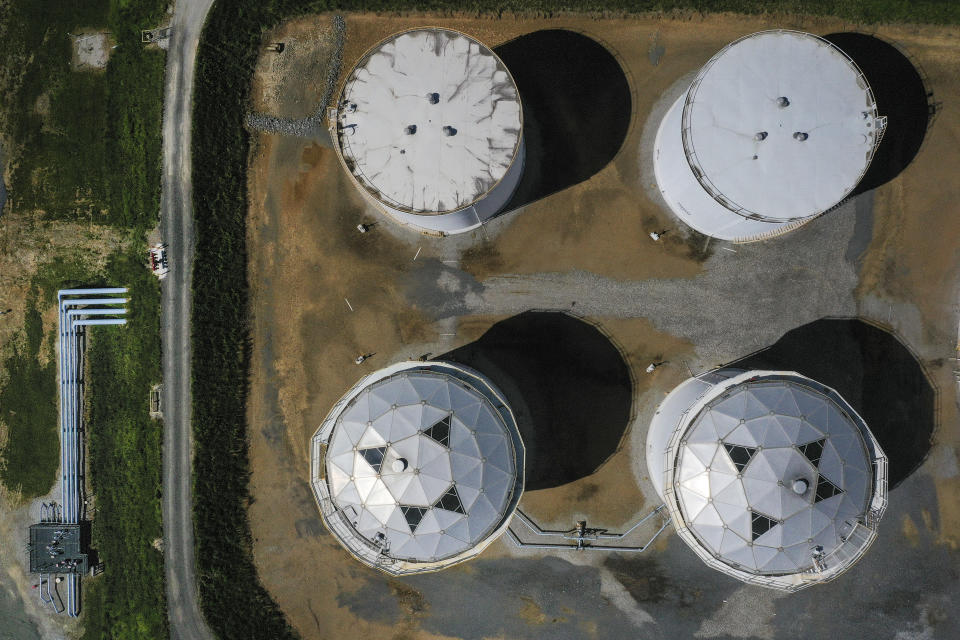 WOODBINE, MD - MAY 13: In an aerial view, fuel holding tanks are seen at Colonial Pipeline's Dorsey Junction Station on May 13, 2021 in Woodbine, Maryland. The Colonial Pipeline has returned to operations following a cyberattack that disrupted gas supply for the eastern U.S. for days. (Photo by Drew Angerer/Getty Images)