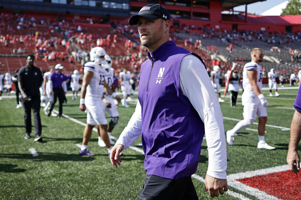 Northwestern interim head coach David Braun walks off after losing to Rutgers in an NCAA college football game, Sunday, Sept. 3, 2023, in Piscataway, N.J. (AP Photo/Adam Hunger)