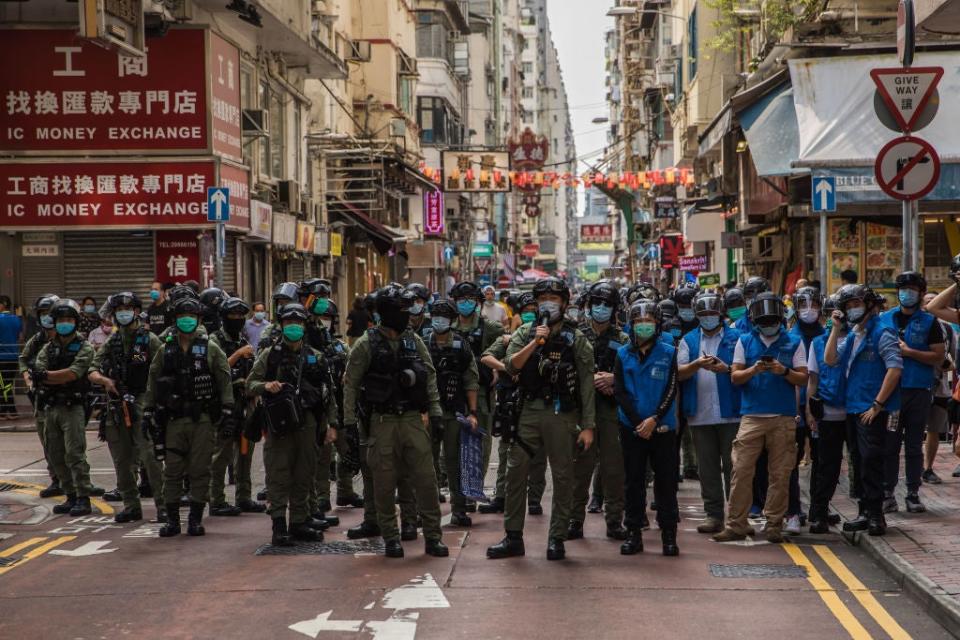 Two other members of Chung’s now-disbanded activism group were also arrested (AFP via Getty Images)