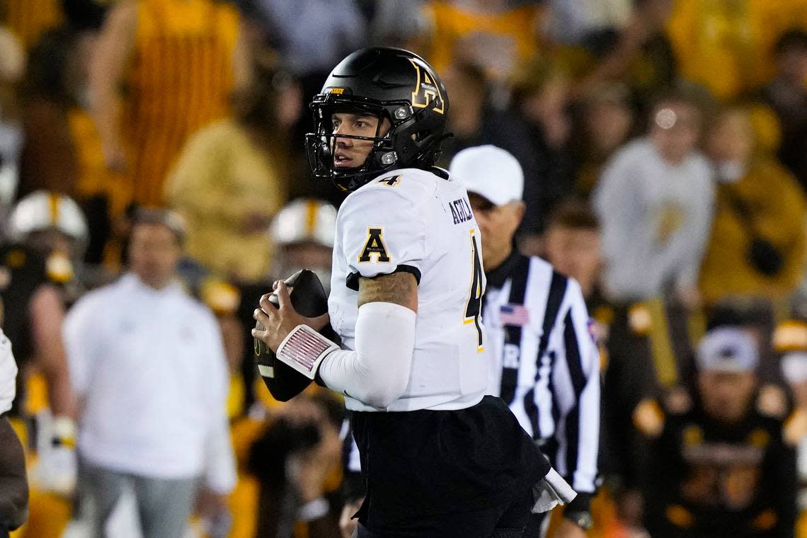 Sep 23, 2023; Laramie, Wyoming, USA; Appalachian State Mountaineers quarterback Joey Aguilar (4) looks to throw against the Wyoming Cowboys during the fourth quarter at Jonah Field at War Memorial Stadium. Troy Babbitt/USA TODAY Sports