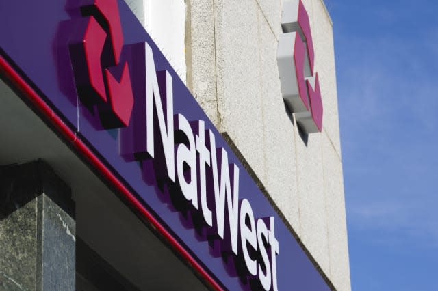 Natwest signs and logo on a high street bank building.