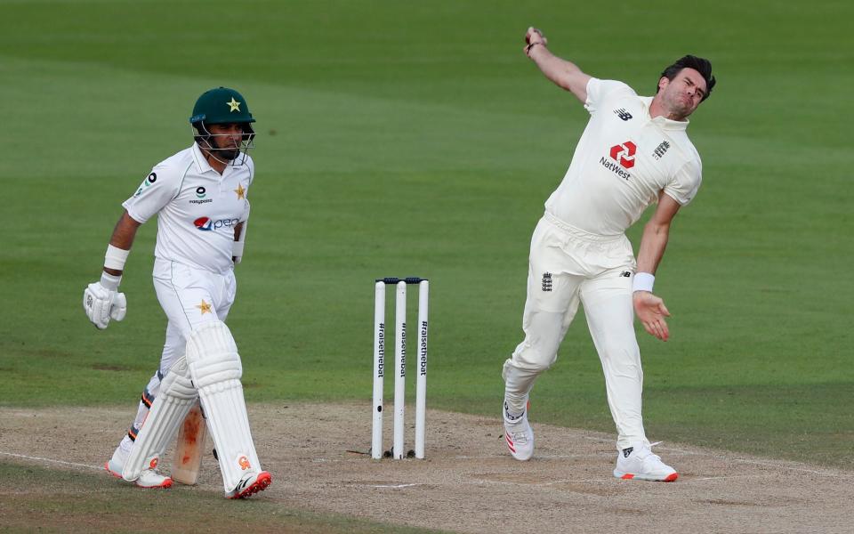 England's James Anderson, right, bowls to Pakistan's Shan Masood during the second day of the third cricket Test match between England and Pakistan - AP