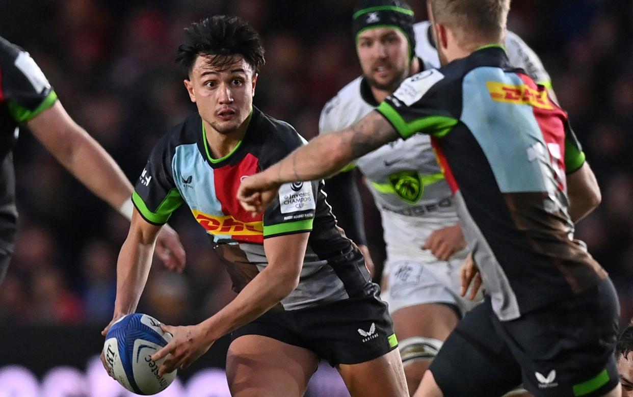 Harlequins' English fly-half Marcus Smith makes a break during the European Rugby Champions Cup pool 2 rugby union match between Harlequins and Toulouse at the Twickenham Stoop Stadium, in Twickenham, London, on December 17, 2023