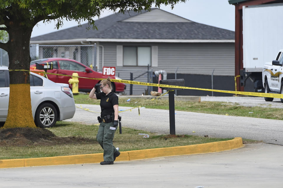 Personnel work at the site of the Lavish Night Club where a shooting early Sunday night left numerous dead and at least 8 injured Sunday, July 5, 2020, in Greenville, S.C. (AP Photo/Richard Shiro)