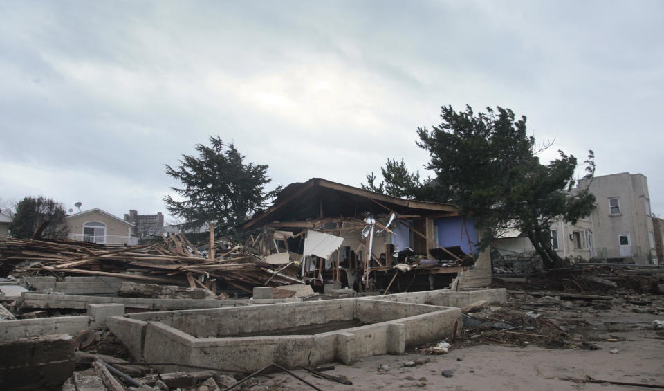 A beachfront house is completely destroyed in the aftermath of yesterday's surge from superstorm Sandy, Tuesday, Oct. 30, 2012, in Coney Island's Sea Gate community in New York. (AP Photo/Bebeto Matthews)