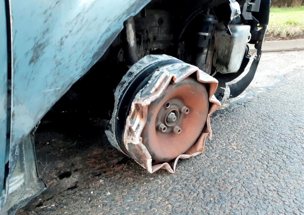 A car pulled over by police after it was seen driving in Nottinghamshire without a wheel. (SWNS/Nottinghamshire Roads Policing Unit)