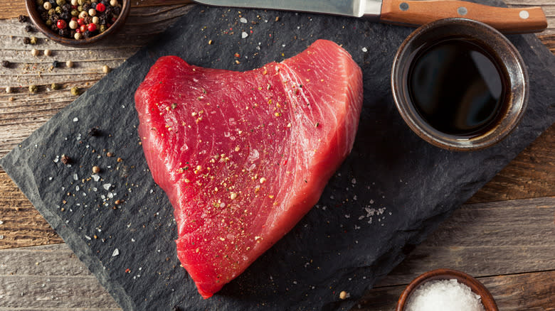 raw tuna steak with salt and pepper