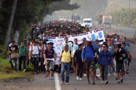 Migrants from Central America and Cuba walk on a highway during their journey towards the United States, in Tuzantan, Chiapas state, Mexico March NO RESALES. NO ARCHIVES