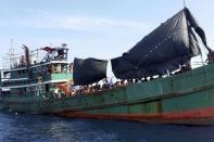 Hundreds of migrants are seen on a boat drifting 17 km (10 miles) off the coast of the southern island of Koh Lipe, Thailand May 14, 2015. REUTERS/Stringer