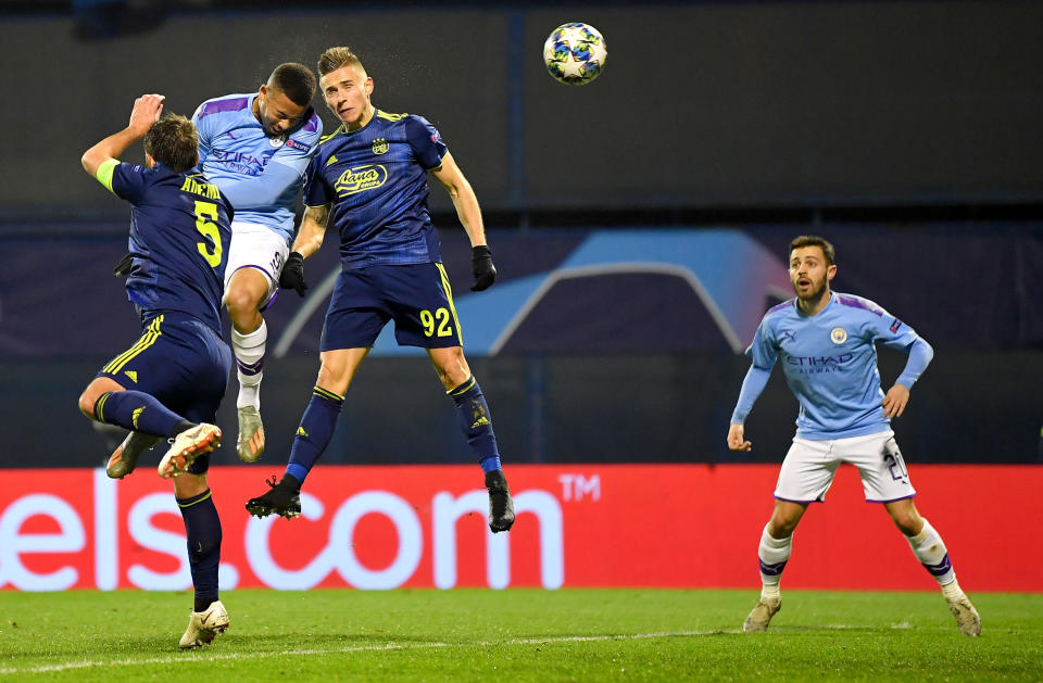 ZAGREB, CROATIA - DECEMBER 11: Gabriel Jesus of Manchester City scores his team's first goal past Damian Kadzior and Arijan Ademi of GNK Dinamo Zagreb during the UEFA Champions League group C match between Dinamo Zagreb and Manchester City at Maksimir Stadium on December 11, 2019 in Zagreb, Croatia. (Photo by Dan Mullan/Getty Images)