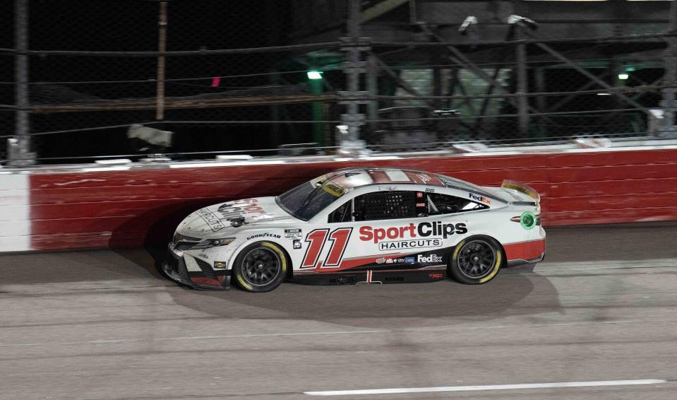 Sep 4, 2022; Darlington, South Carolina, USA; Denny Hamlin, driver of the (11) Sport Clips Haircuts Toyota, in turn four during the COOK OUT Southern 500 at Darlington Raceway. Mandatory Credit: David Yeazell-USA TODAY Sports