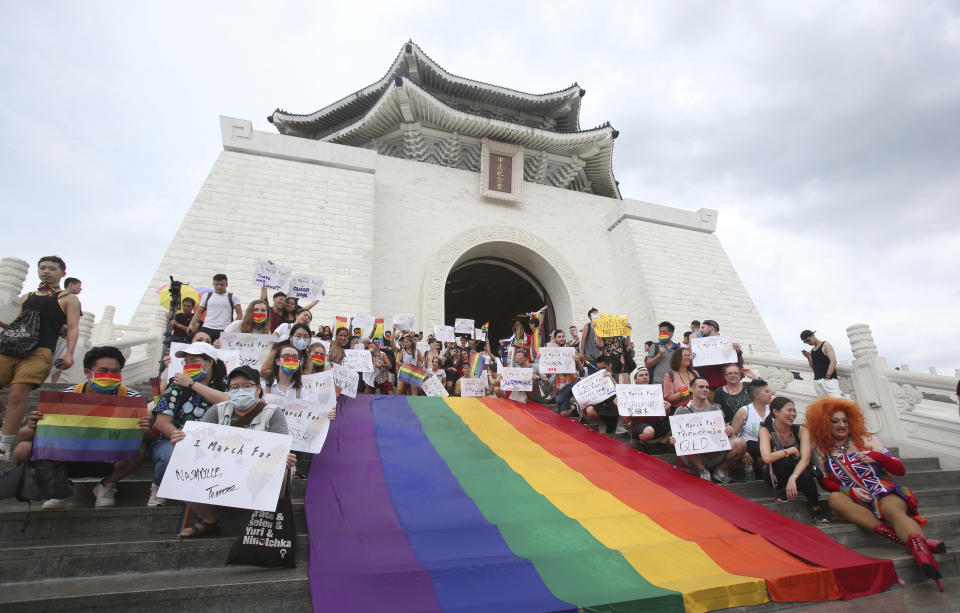 Participants rally during the "Taiwan Pride March for the World!" at Liberty Square at the CKS Memorial Hall in Taipei, Taiwan, Sunday, June 28, 2020. This year marks the first Gay Pride march in Chicago 1970, and due to the COVID-19 lockdown, Taiwan is one of the very few countries to host the world's only physical Gay Pride. (AP Photo/Chiang Ying-ying)