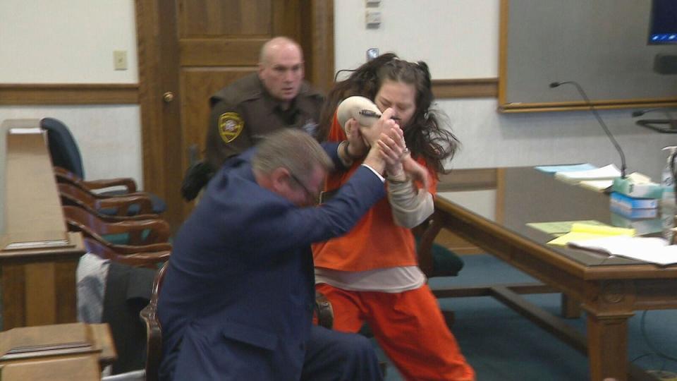 Taylor Schabusiness attacks her attorney, Quinn Jolly, in Brown County court in Green Bay, Wis., on Tuesday, Feb. 14, 2023 (AP)