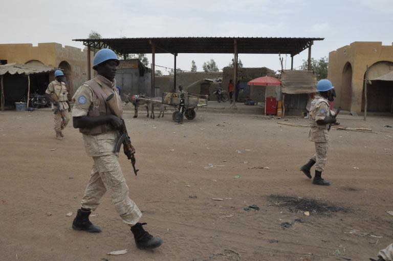 UN peacekeepers patrol on May 12, 2015 in Timbuktu after an attack by the rebel Coordination of Azawad Movements killed nine Malian soldiers