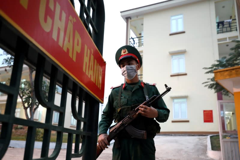 FILE PHOTO: Vietnamese soldier is seen at the gate of a quarantine place at a military base in Lang Son province, Vietnam