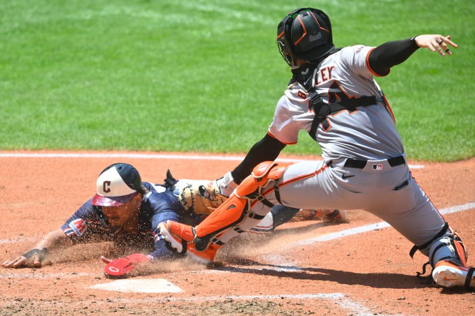 Jul 7, 2024; Cleveland, Ohio, USA; Cleveland Guardians first baseman Josh Naylor (22) is tagged out at home plate by San Francisco Giants catcher Patrick Bailey (14) in the fourth inning at Progressive Field. Mandatory Credit: David Richard-USA TODAY Sports