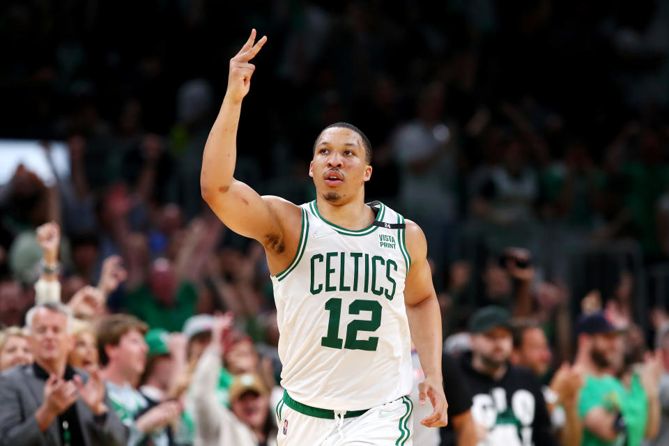 BOSTON, MASSACHUSETTS - MAY 15: Grant Williams #12 of the Boston Celtics reacts after making a three point basket during the third quarter against the Milwaukee Bucks in Game Seven of the 2022 NBA Playoffs Eastern Conference Semifinals at TD Garden on May 15, 2022 in Boston, Massachusetts. NOTE TO USER: User expressly acknowledges and agrees that, by downloading and/or using this photograph, User is consenting to the terms and conditions of the Getty Images License Agreement. (Photo by Adam Glanzman/Getty Images)