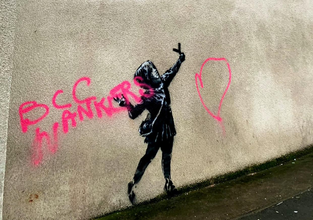 Vandals have ruined a Valentine's Day-inspired Banksy painting by covering it in spray paint (Picture: SWNS)