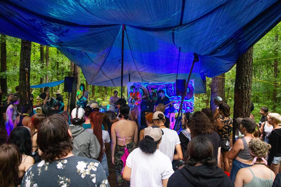 After dark, the activist community hosts dance parties with live music complete with a sound system, rain cover, and a bar. The drinks are cheap, and free if you pay for them by picking up forest floor trash.