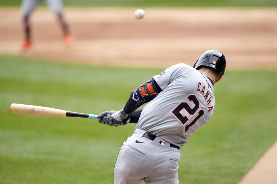 Detroit Tigers' Mark Canha hits a two-run single off Chicago White Sox starting pitcher Michael Soroka during the first inning of a baseball game Saturday, March 30, 2024, in Chicago. Spencer Torkelson and Riley Greene scored on the play. (AP Photo/Charles Rex Arbogast)