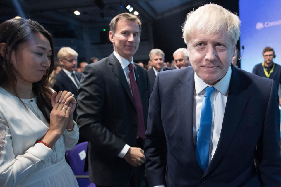 (left to right) Lucia Hunt, Jeremy Hunt and Boris Johnson at the Queen Elizabeth II Centre in London as it was announced Mr Johnson is the new Conservative party leader, and will become the next Prime Minister.