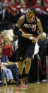 Portland Trail Blazers' LaMarcus Aldridge (12) reacts after making a basket against the Houston Rockets during the third quarter in Game 2 of an opening-round NBA basketball playoff series Wednesday, April 23, 2014, in Houston. Portland won 112-105. (AP Photo/David J. Phillip)