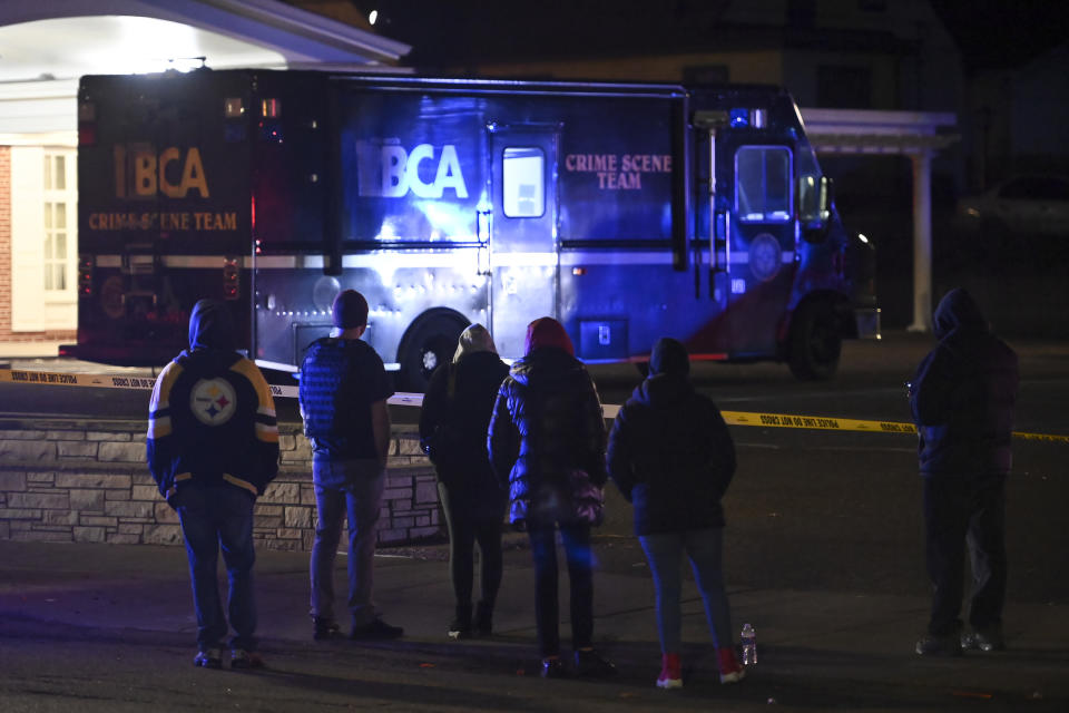 A crowd gathers on Sunday, Nov. 29, 2020, along Rice Street near the scene where St. Paul Police shot a man earlier in the night in St. Paul, Minn. (Aaron Lavinsky/Star Tribune via AP)