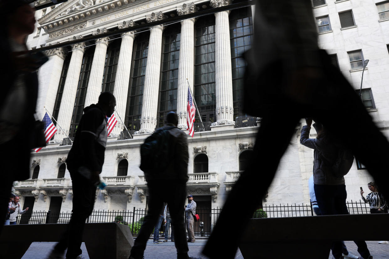 NEW YORK, NEW YORK - SEPTEMBER 23: People walk outside of the New York Stock Exchange (NYSE) on September 23, 2022 in New York City. The Dow Jones Industrial Average has dropped more than 400 points as recession fears grow. (Photo by Spencer Platt/Getty Images)
