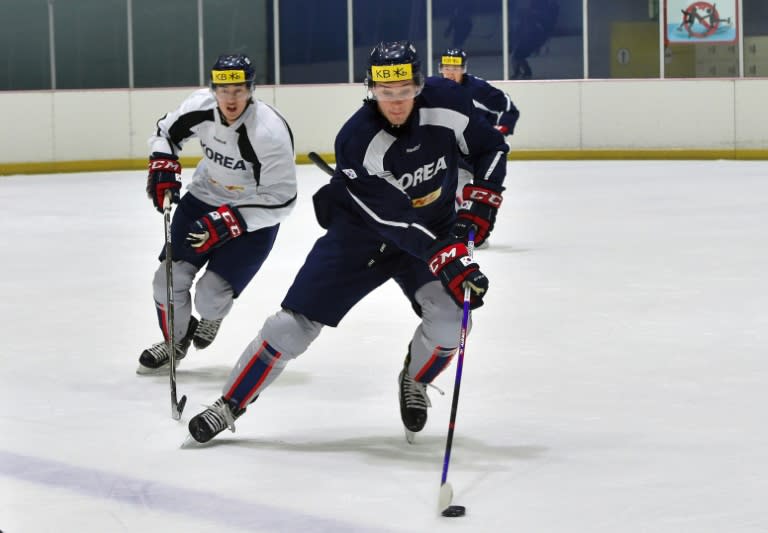 South Korea's ice hockey team player, US-born Mike Testwuide (C), skates during a practice session at a rink in Goyang, north-west of Seoul