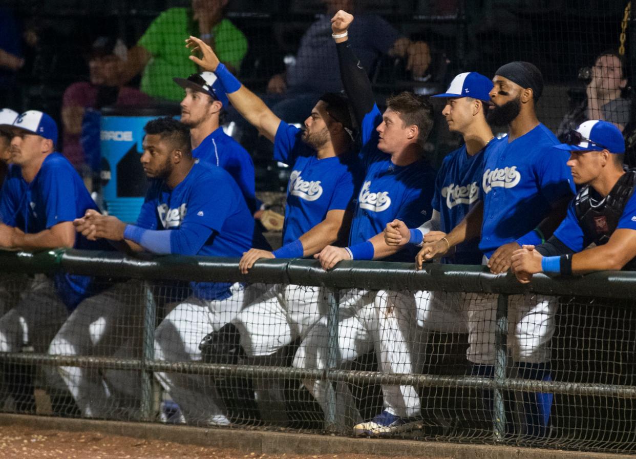 Evansville Otters players encourage a teammate after getting a base hit against the Windy City Thunderbolts at Bosse Field in Evansville, Ind., Tuesday night, Aug. 16, 2022. The Otters lost the game 5-2.