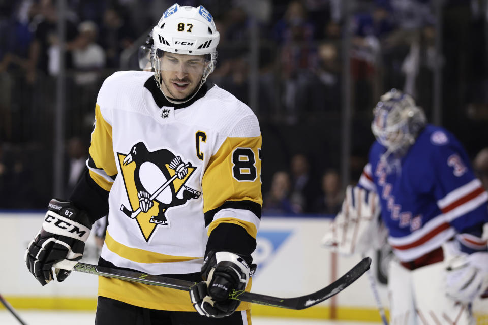 Pittsburgh Penguins center Sidney Crosby (87) reacts as he skates past New York Rangers goaltender Igor Shesterkin during the first period in Game 7 of an NHL hockey Stanley Cup first-round playoff series, Sunday, May 15, 2022, in New York. (AP Photo/Adam Hunger)