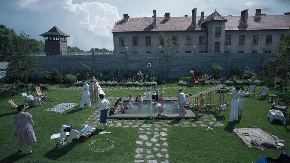 The Hoss family enjoys a seemingly idyllic afternoon just over the wall from Auschwitz. I imagined a prisoner hearing the sounds of the Hoss children splashing and laughing in their swimming pool on the other side of the wall, says Glazer.