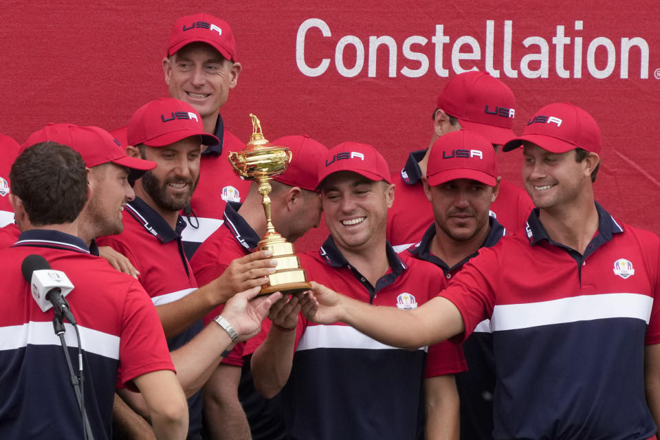 Team USA holds the trophy after the Ryder Cup matches at the Whistling Straits Golf Course Sunday, Sept. 26, 2021, in Sheboygan, Wis. (AP Photo/Charlie Neibergall)