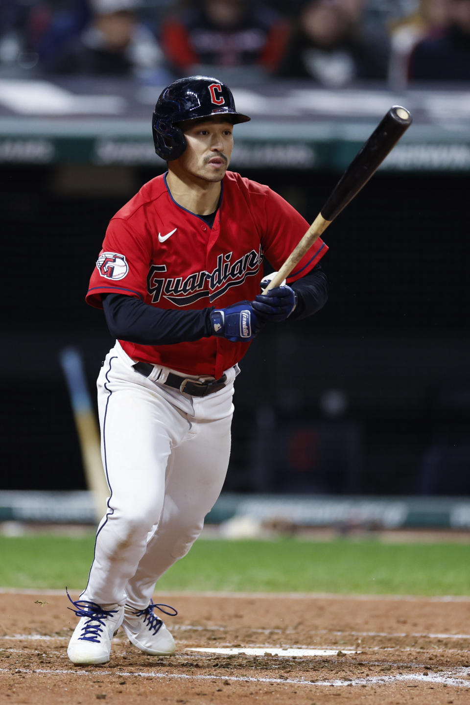 Cleveland Guardians' Steven Kwan watches his single off Kansas City Royals starting pitcher Zack Greinke during the fifth inning of a baseball game, Monday, Oct. 3, 2022, in Cleveland. (AP Photo/Ron Schwane)