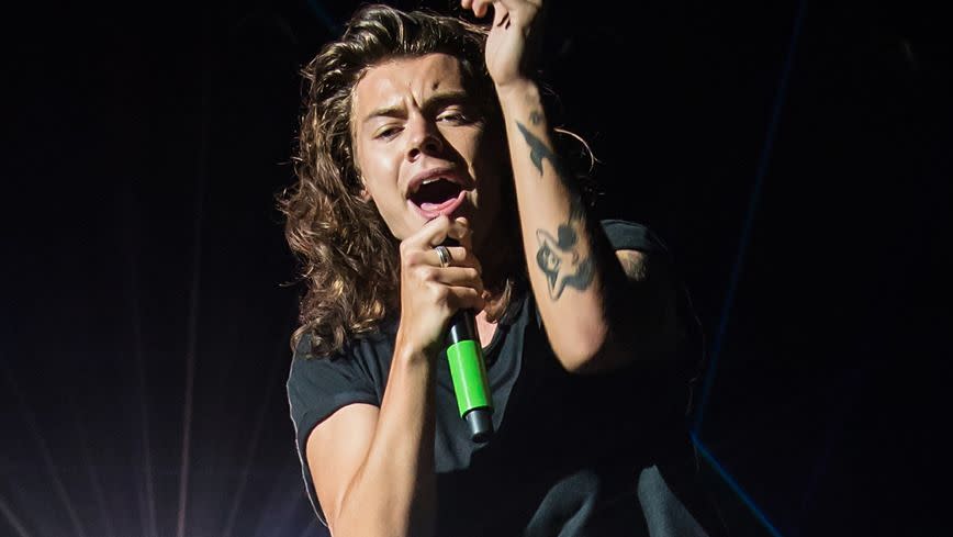 Ballseye! Harry Styles gets hit in the crown jewels with a bottle