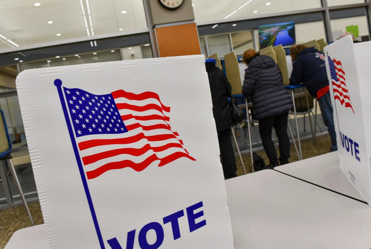 People fill out their ballots during general election voting Tuesday, Nov. 8, 2022, at the Sauk Rapids Government Center.    