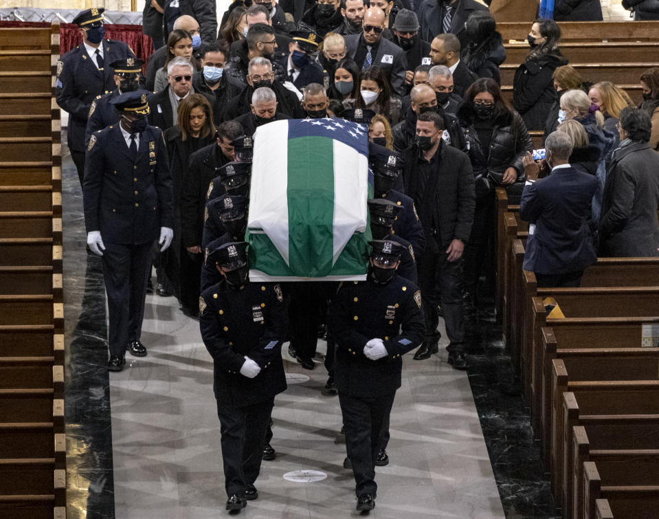 Slain NYPD officer Wilbert Mora's casket is carried at the completion of a funeral service at St. Patrick's Cathedral in New York Wednesday, Feb. 2, 2022. Mora was shot and killed after responding to a domestic dispute call on Jan. 21 with his partner Jason Rivera, who was also fatally wounded. (Craig Ruttle/Newsday via AP, Pool)