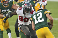 Tampa Bay Buccaneers outside linebacker Jason Pierre-Paul (90) chases Green Bay Packers quarterback Aaron Rodgers (12) during the second half of an NFL football game Sunday, Oct. 18, 2020, in Tampa, Fla. (AP Photo/Mark LoMoglio)