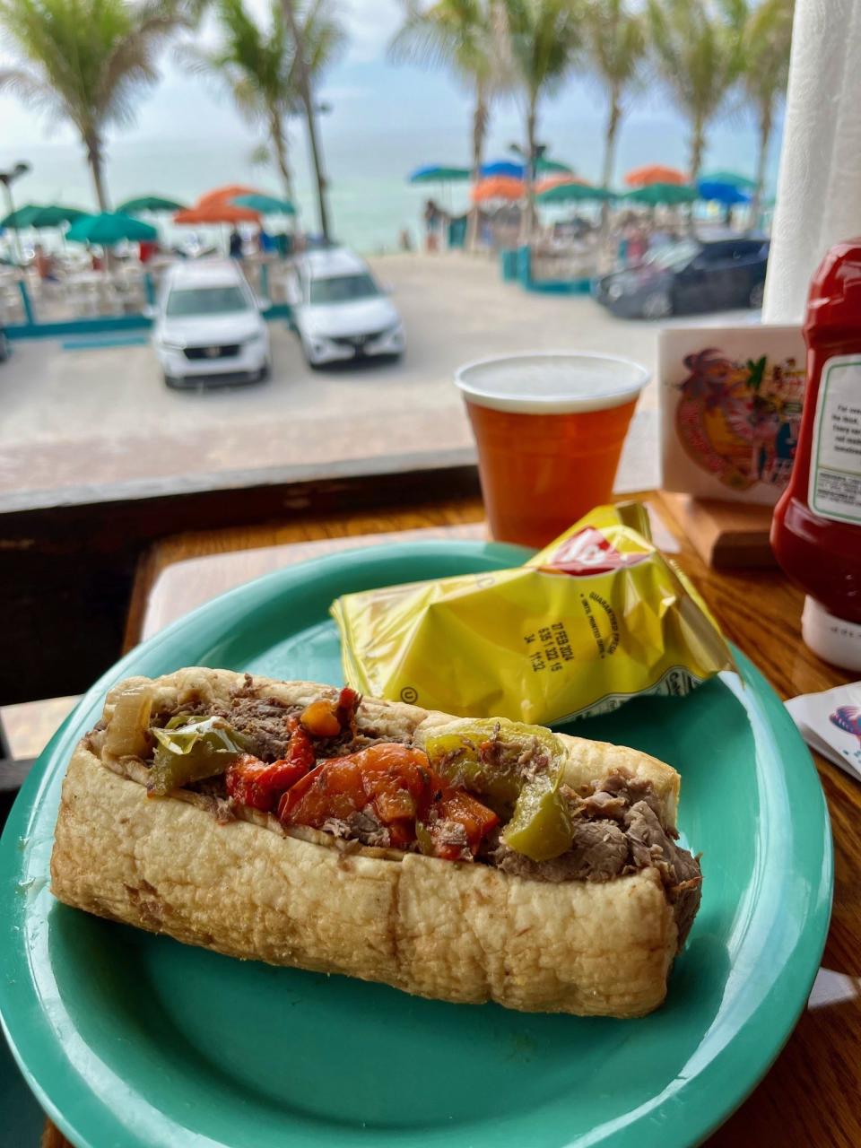 Chicago-style Italian beef with roasted sweet peppers and hot giardiniera on a Turano roll is a popular order at Doc's Beach House in Bonita Springs.