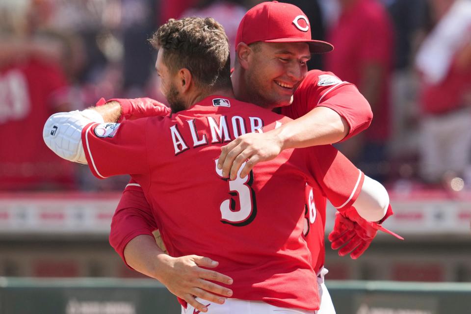 Cincinnati Reds' Albert Almora Jr. (3) celebrates with teammate Joel Kuhnel after hitting a winning single against the Atlanta Braves in the ninth inning of a baseball game Sunday, July 3, 2022, in Cincinnati.