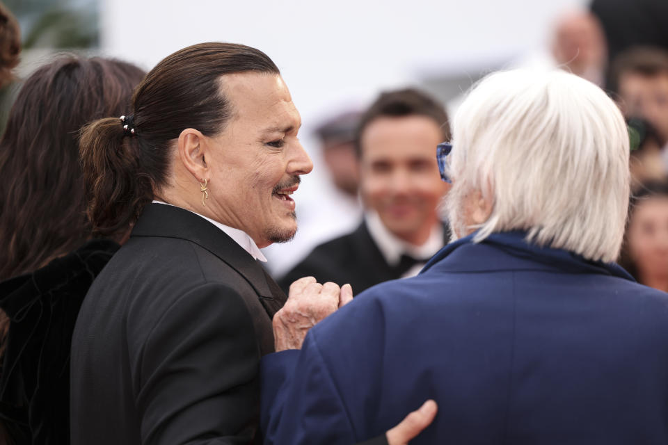 Johnny Depp, left, poses for photographers upon arrival at the opening ceremony and the premiere of the film 'Jeanne du Barry' at the 76th international film festival, Cannes, southern France, Tuesday, May 16, 2023. (Photo by Vianney Le Caer/Invision/AP)