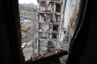 A view of an apartment building, damaged during a heavy fighting, in Mariupol, in Russian-controlled Donetsk region, eastern Ukraine, Thursday, Jan. 5, 2023. (AP Photo/Alexei Alexandrov)