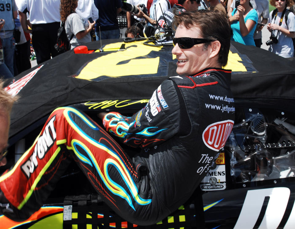 FILE - In this April 25, 2010, file photo, Jeff Gordon climbing into his car as he prepares to start the NASCAR Sprint Cup Series Aaron's 499 auto race at Talladega Superspeedway in Talladega, Ala. Gordon headlines the 10th class of the NASCAR Hall of Fame for his storied career on and off the track. He'll be inducted on Friday night, Feb. 1,2019, along with NASCAR team owners Roger Penske and Jack Roush. (AP Photo/Rainier Ehrhardt, File)