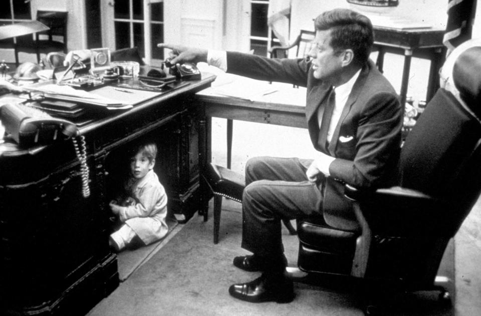 John Kennedy Jr. plays in the Oval Office at the White House, Washington, DC, on October 15, 1963.  